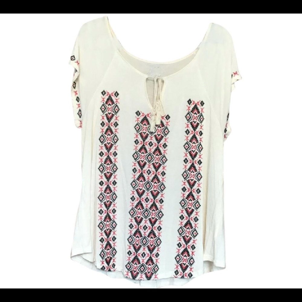 Cute ivory with black and red embroidery.